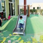 kid on slide